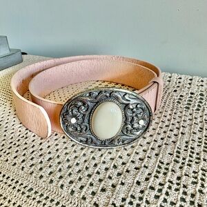 Pink leather belt with silver tone Western style buckle. Women's Size XL